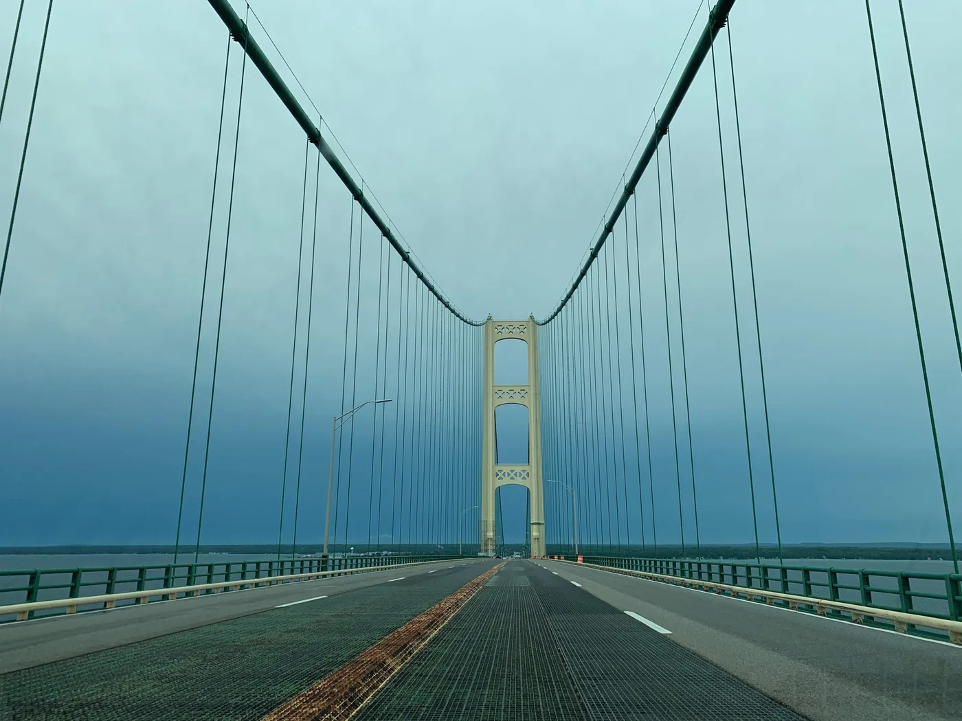 Driving across the Mackinac Bridge, both towers ahead